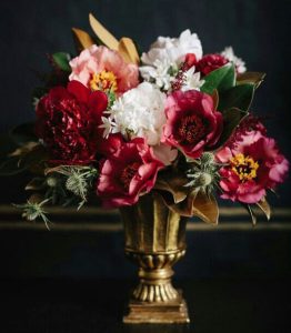 gold vase with flowers