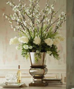 square vase with wine and book